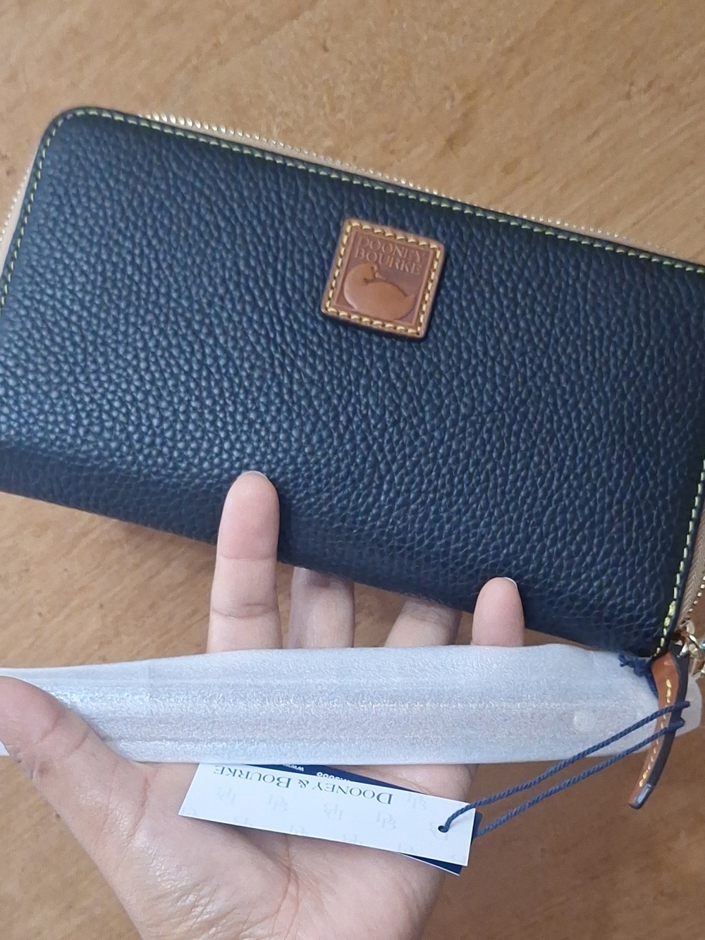 Dooney & Bourke Black Pebbled Zip Wallet with Tan Trim